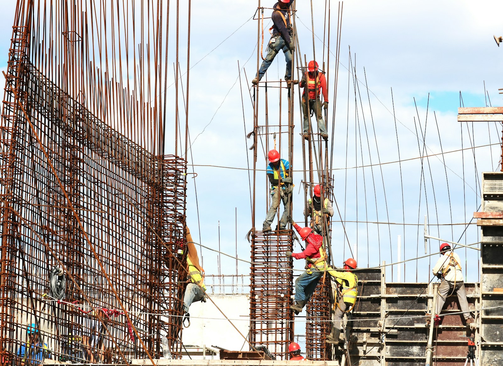 Construction crew installing reinforcement steel for structural work