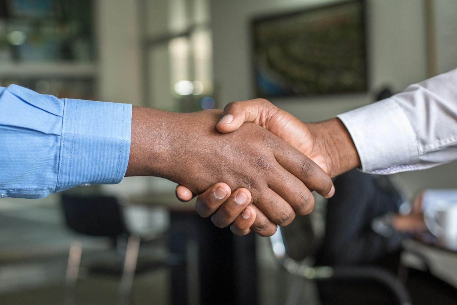 Business handshake representing a construction tender agreement